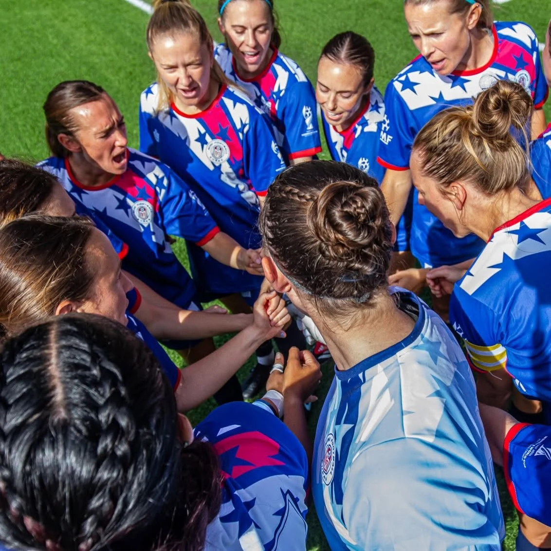 Mini Football USA players huddle before kickoff